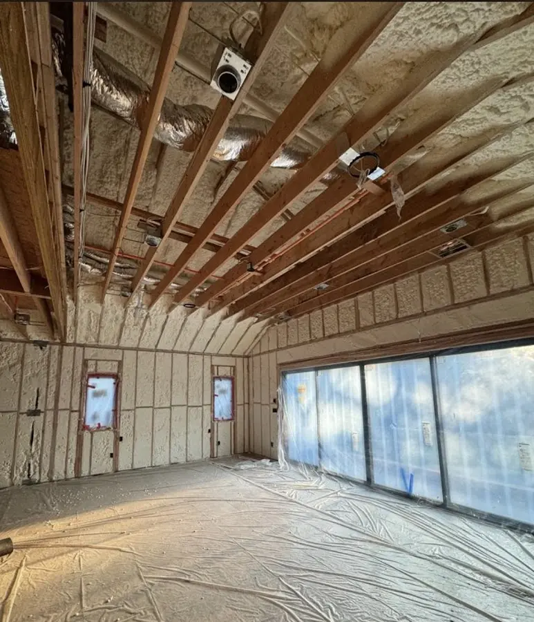 Interior walls and ceiling insulated with spray foam during new construction in Cudahy